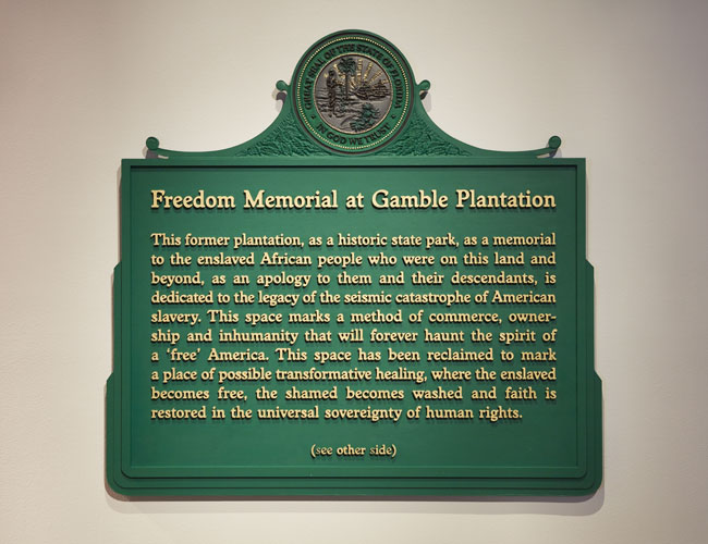 John Sims, Freedom Memorial Marker, 2020. Latex paint on synthetic material. Courtesy of the artist. Installation View of Marking Monuments exhibition at USF Contemporary Art Museum. Photo: Will Lytch.