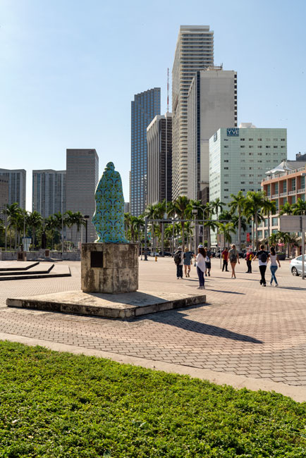 Joiri Minaya, The Cloaking of the statue of Ponce de Leon at the Torch of Friendship on Biscayne Blvd, Miami, Florida, 2019. dye-sublimation print on spandex fabric and wood scructure. Photos by Zachary Balber, commissioned by Fringe Projects Miami. Courtesy of the artist.